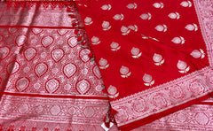 BKS128 Banarasi Mashru silk Saree in red. Comes with silver zari work. Comes with stitched blouse size 38 can be altered to size 42. Fall peco done.