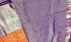 KSS415 Pure kanchipuram tissue silk Saree in orange with purple border gold zari work.comes with stitched blouse size 40,can be altered to 44 size.