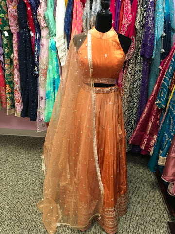 AFL9033 lehenga in orange . Comes with matching stitched blouse and dupatta.