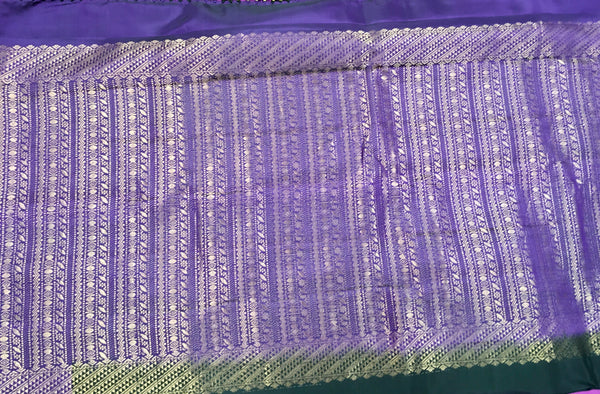 KSS438 kanchipuram silk Saree in black with purple gold zari border.comes with stitched blouse size 40,can be altered to 44 size.
