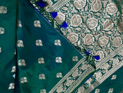 BKS120 Banarasi Mashru silk Saree in green. Comes with gold zari work. Comes with stitched blouse size 38 can be altered to size 42. Fall peco done.