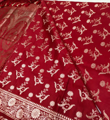 BKS121 Banarasi Mashru silk Saree in maroon. comes with gold zari work. Comes with stitched blouse size 38 can be altered to size 42. Fall peco done.