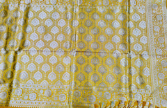 BKS117 Banarasi Mashru silk Saree in yellow. Comes with gold zari work. Comes with stitched blouse size 38 can be altered to size 42. Fall peco done.