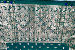 BKS120 Banarasi Mashru silk Saree in green. Comes with gold zari work. Comes with stitched blouse size 38 can be altered to size 42. Fall peco done.