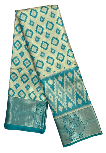 HPSS604 - Banarasi Soft Silk Saree in Cream with Blue Patola design. Peacock Zari Butta on Border. Comes with stitched blouse (size 38, can go up to size 42). Fall Peco Done.