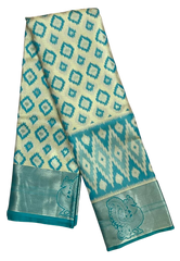 HPSS604 - Banarasi Soft Silk Saree in Cream with Blue Patola design. Peacock Zari Butta on Border. Comes with stitched blouse (size 38, can go up to size 42). Fall Peco Done.