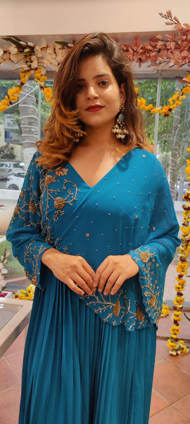 RFSS1115 - Indo-Western Gown with heavy Emberoidery work on yoke. Comes with 1 sides Kaftan sleeve. 
2 colors: Copper Sulphate Blue and Carrot Pink