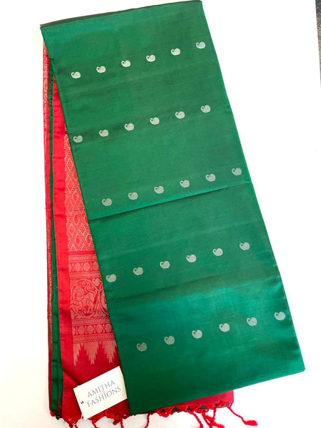 Pure Kanjivaram Handloom Soft Silk saree in Bottle Green w/ Mango Zari Buttas and Zari Border. Comes w/ Maroon Zari Pallu and Maroon Blouse