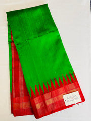 Pure Kanjivaram Handloom Raw Silk saree in Bright Green w/ Red Gopuram Border. Comes w/ Red Zari Pallu & Red Blouse (stitched). Fall Peco Done.