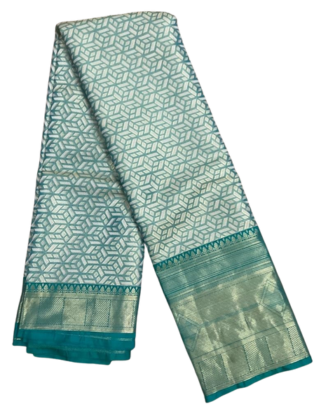 HPSS609 - Banarasi Soft Silk Saree in Silver with Sea Green Border. Comes with stitched blouse (size 38, can go up to size 42). Fall Peco Done.