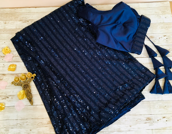 AM315 - imported sequin saree in navy blue. Comes with stitched blouse size 38, can be altered to size 42
