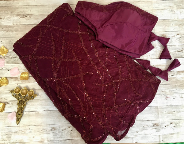 AM303 - Imported sequin saree in plum color. Comes with stitched blouse size 38, can be altered to size 42