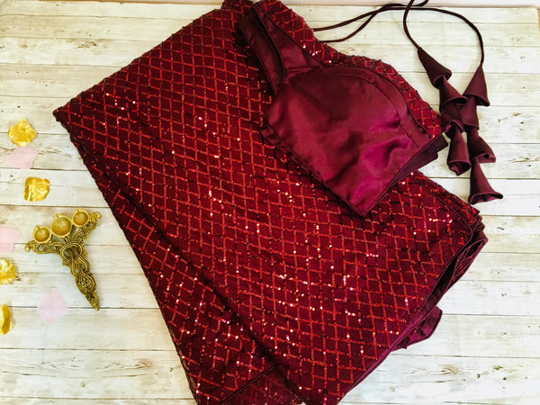 AM307 - imported diamond sequin saree in maroon color.Comes with stitched blouse size 38, can be altered to size 42