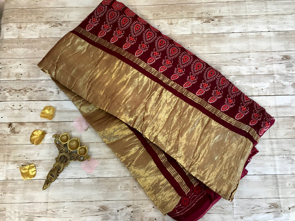 KSS106 - Pure Modal silk saree with ajrakh print in maroon with lagda patti .Comes with stitched blouse size 38 can be altered to 42.